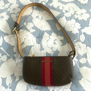 Michael Kors, small brown purse with pink stripe. 9“ x 5 1/2 in size